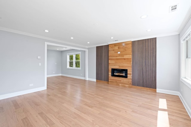 44 Cranbrook Dr, Des Plaines, IL 60016 - unfurnished living room featuring crown molding, recessed lighting, baseboards, light wood finished floors, and a fireplace