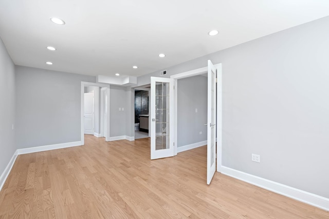 44 Cranbrook Dr, Des Plaines, IL 60016 - empty room with baseboards, recessed lighting, light wood-style floors, and french doors