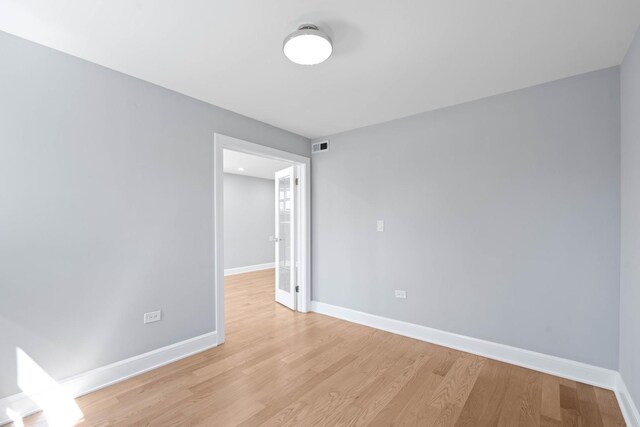 44 Cranbrook Dr, Des Plaines, IL 60016 - spare room featuring baseboards and light wood-type flooring