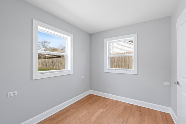 44 Cranbrook Dr, Des Plaines, IL 60016 - unfurnished room featuring plenty of natural light, light wood-style floors, and baseboards