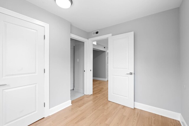 44 Cranbrook Dr, Des Plaines, IL 60016 - unfurnished bedroom with light wood-style flooring and baseboards