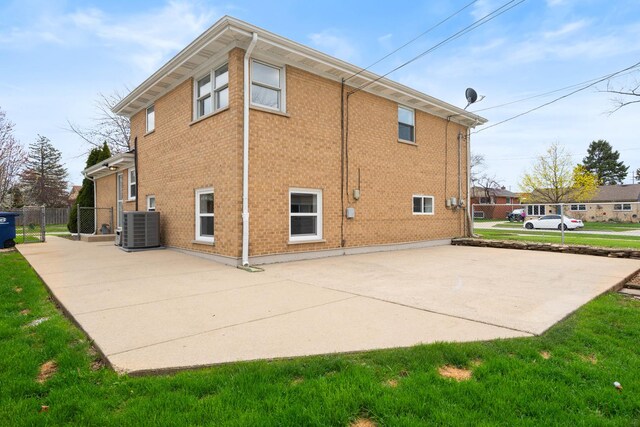 44 Cranbrook Dr, Des Plaines, IL 60016 - rear view of house featuring central AC, a patio, and brick siding