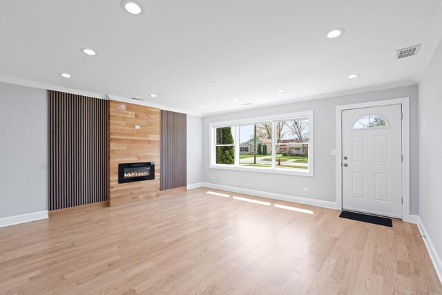 44 Cranbrook Dr, Des Plaines, IL 60016 - entryway featuring ornamental molding, recessed lighting, baseboards, light wood-style flooring, and a fireplace