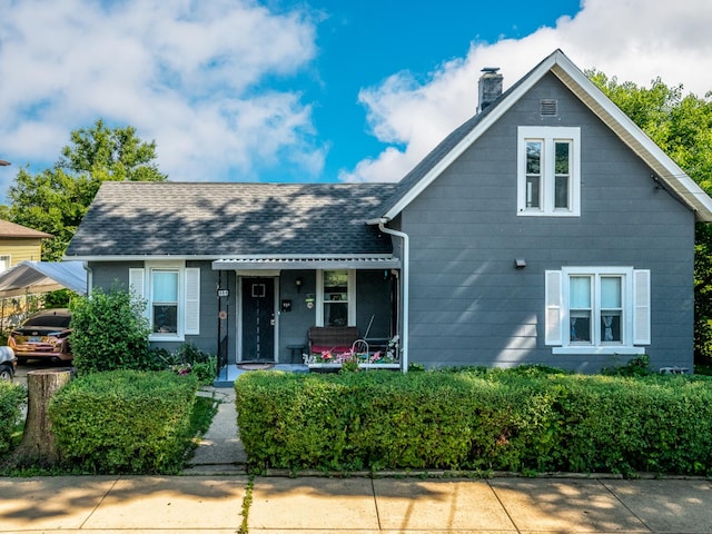 484 Hickory Pl, Elgin, IL 60120 - view of front of home with a chimney and covered porch