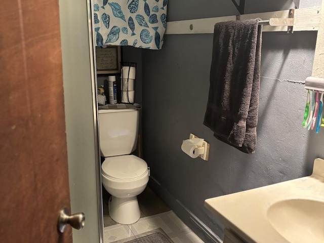 484 Hickory Pl, Elgin, IL 60120 - half bathroom featuring toilet, tile patterned flooring, and vanity