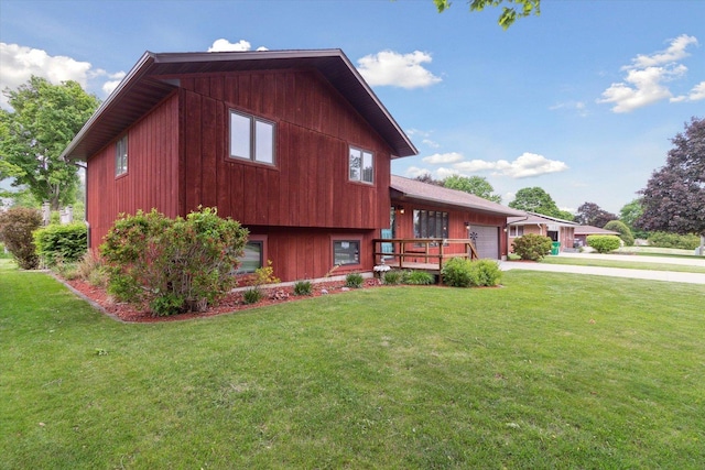608 E Webster St, Polo, IL 61064 - view of front facade with an attached garage, a front yard, and concrete driveway