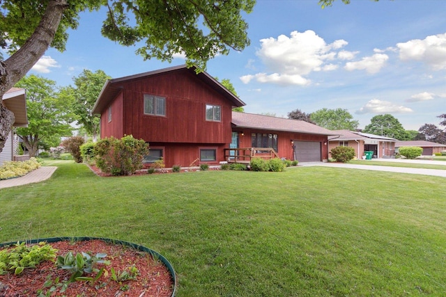 608 E Webster St, Polo, IL 61064 - split level home with an attached garage, a front yard, and concrete driveway