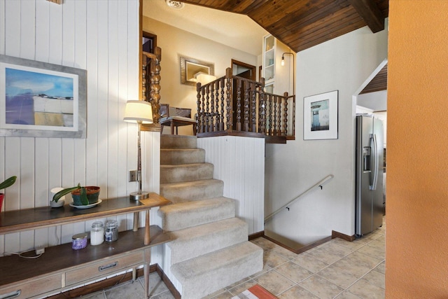 608 E Webster St, Polo, IL 61064 - stairway featuring wood ceiling, wood walls, baseboards, lofted ceiling, and tile patterned floors