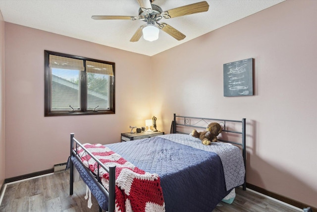 608 E Webster St, Polo, IL 61064 - bedroom featuring wood finished floors, baseboards, and ceiling fan
