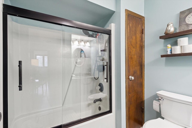 608 E Webster St, Polo, IL 61064 - bathroom with bath / shower combo with glass door and toilet