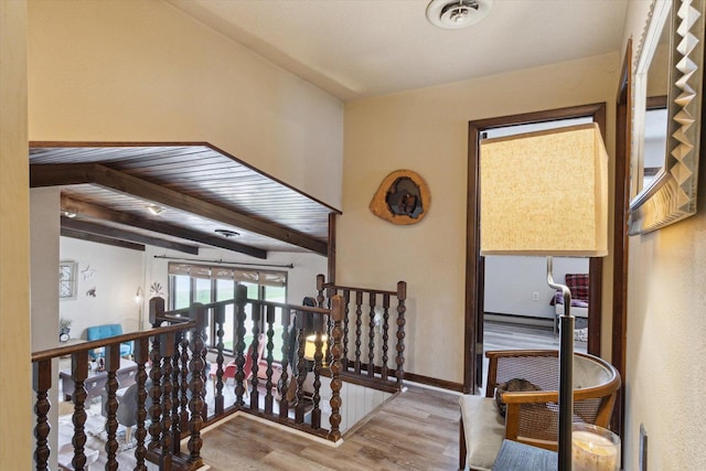 608 E Webster St, Polo, IL 61064 - corridor with an upstairs landing, wood finished floors, and beamed ceiling