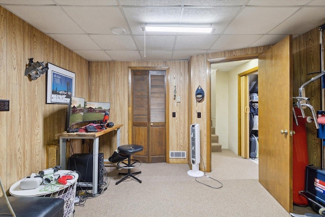 608 E Webster St, Polo, IL 61064 - home office featuring carpet floors, wooden walls, and a drop ceiling