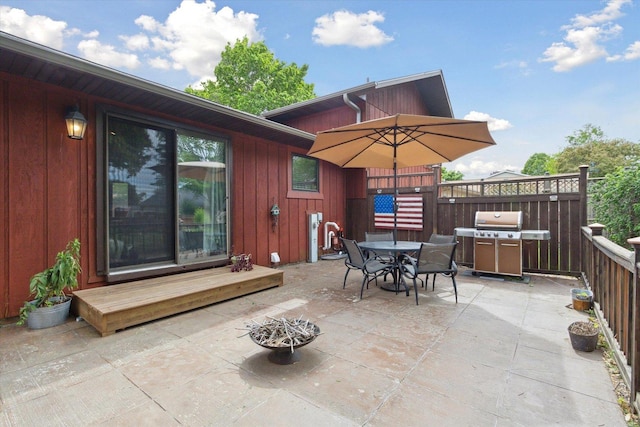 608 E Webster St, Polo, IL 61064 - view of patio / terrace featuring outdoor dining space, grilling area, and a wooden deck