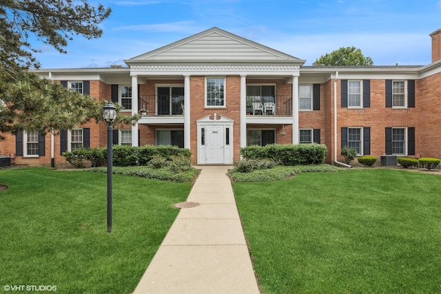 565 Shorely Dr Unit 202, Barrington, IL 60010 - view of front of home featuring a front lawn, brick siding, and central AC