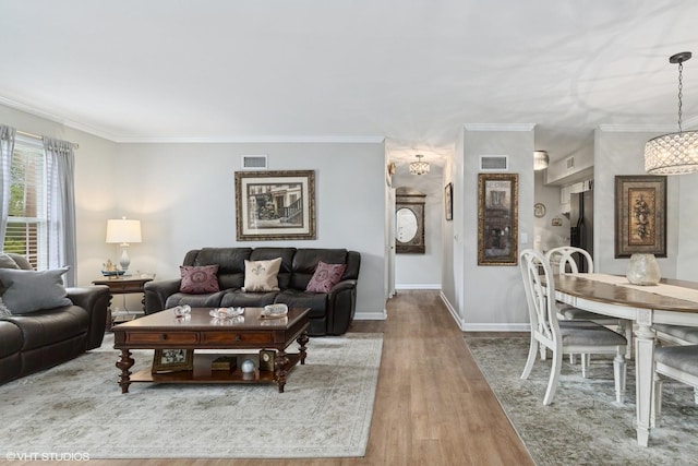 565 Shorely Dr Unit 202, Barrington, IL 60010 - living area featuring wood finished floors, crown molding, and baseboards