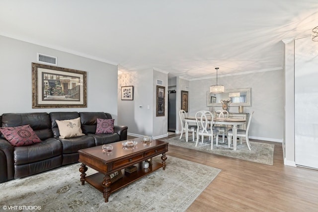 565 Shorely Dr Unit 202, Barrington, IL 60010 - living area featuring wood finished floors, baseboards, and crown molding