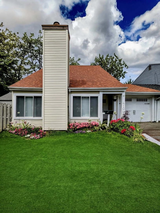 410 Wildwood Ct Unit 410, Romeoville, IL 60446 - view of front of property with a chimney, roof with shingles, an attached garage, and driveway