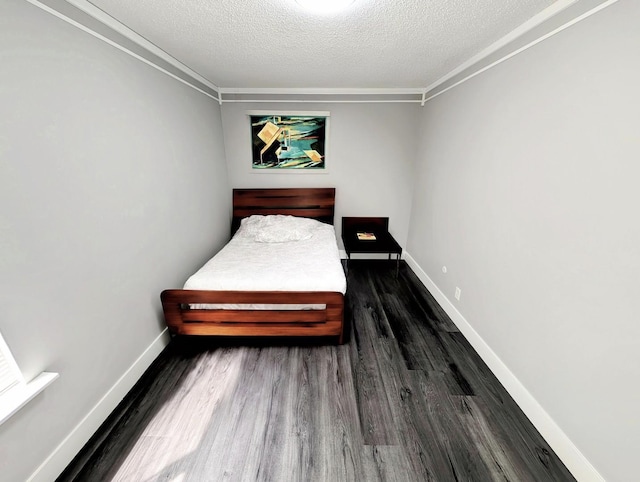 410 Wildwood Ct Unit 410, Romeoville, IL 60446 - bedroom with wood finished floors, a textured ceiling, baseboards, and crown molding