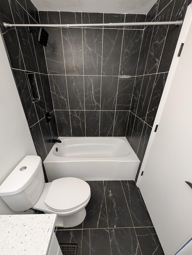 410 Wildwood Ct Unit 410, Romeoville, IL 60446 - bathroom featuring marble look tiles, toilet, and tub / shower combination