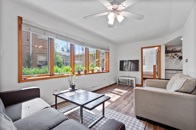 5855 W Higgins Ave Unit Gr, Chicago, IL 60630 - living area featuring wood finished floors, a ceiling fan, and baseboards