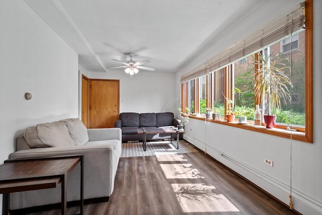 5855 W Higgins Ave Unit Gr, Chicago, IL 60630 - living room with plenty of natural light, dark wood-style flooring, a ceiling fan, and a baseboard heating unit