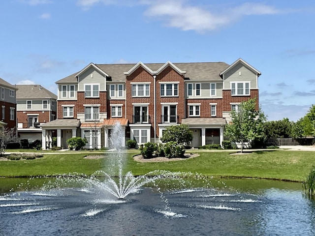 203 W Hyde St, Arlington Heights, IL 60005 - view of front of home featuring a water view, a front yard, and brick siding