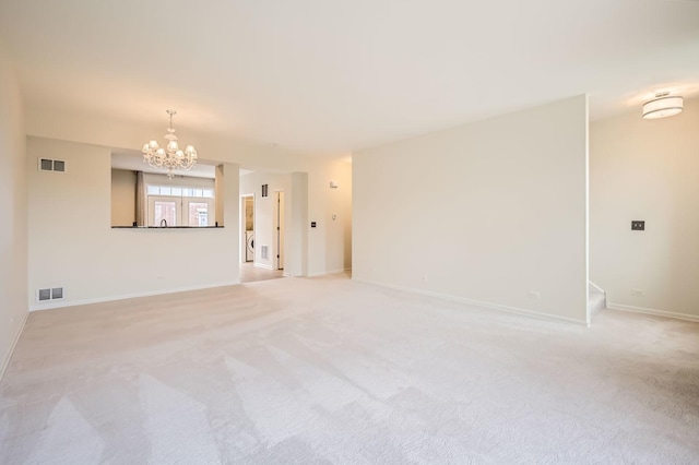 203 W Hyde St, Arlington Heights, IL 60005 - empty room with a chandelier, light colored carpet, and baseboards