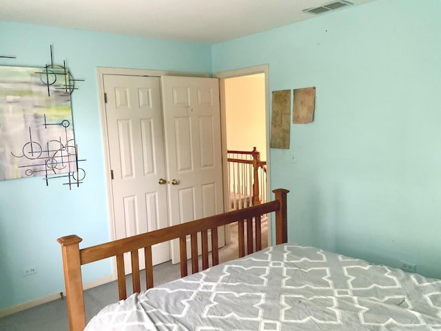 carpeted bedroom with a closet