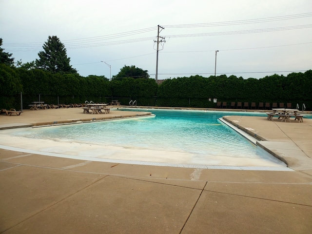 community pool featuring a patio