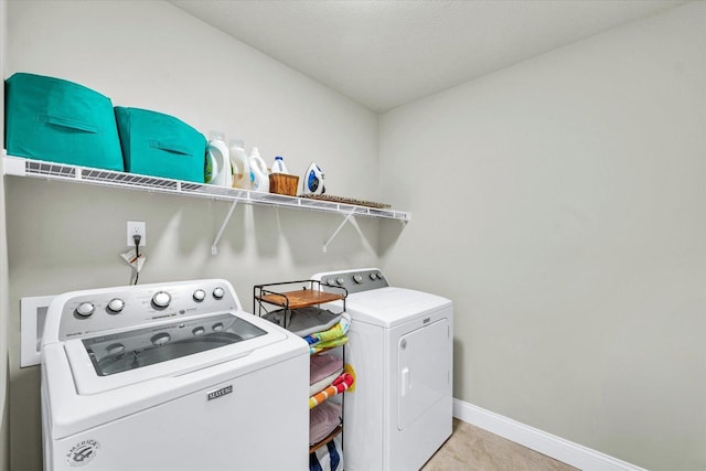 31 Lodge Trl, Monticello, IL 61856 - laundry room with washing machine and clothes dryer and baseboards