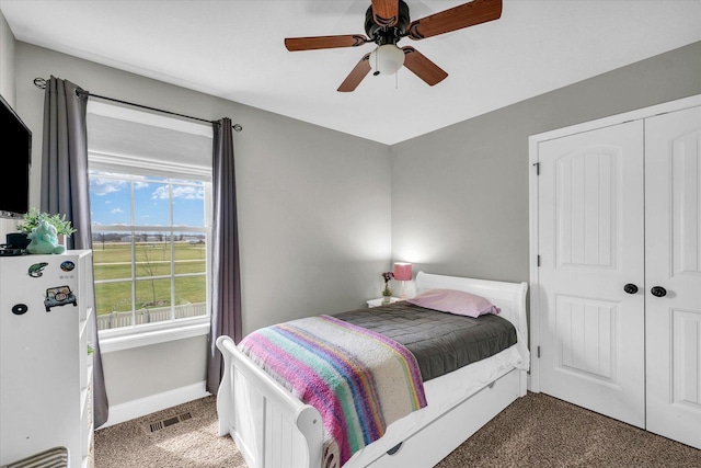 31 Lodge Trl, Monticello, IL 61856 - carpeted bedroom featuring freestanding refrigerator, baseboards, a closet, and ceiling fan