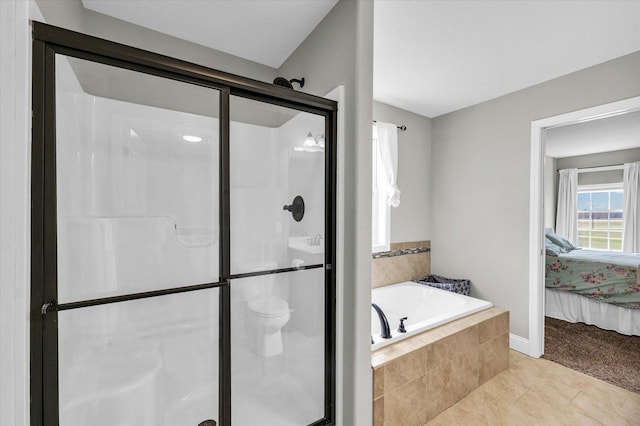 31 Lodge Trl, Monticello, IL 61856 - bathroom featuring a shower stall, connected bathroom, a bath, tile patterned flooring, and baseboards