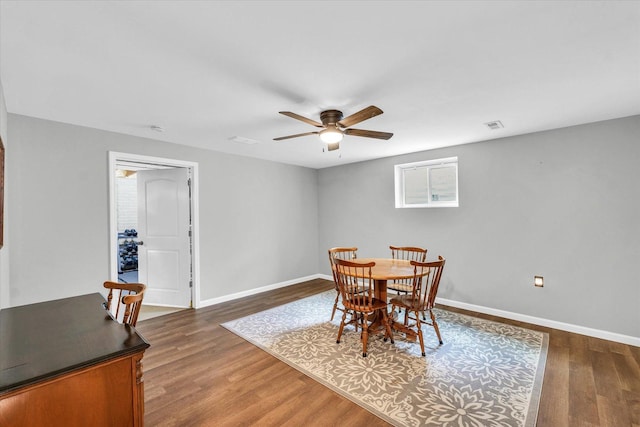 31 Lodge Trl, Monticello, IL 61856 - dining space with ceiling fan, dark wood-style flooring, and baseboards