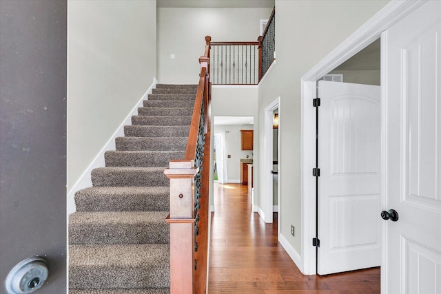 31 Lodge Trl, Monticello, IL 61856 - staircase with wood finished floors and baseboards