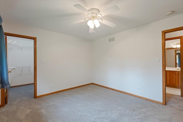 2261 E Gaisor Dr, Crete, IL 60417 - empty room with light carpet, a ceiling fan, and baseboards