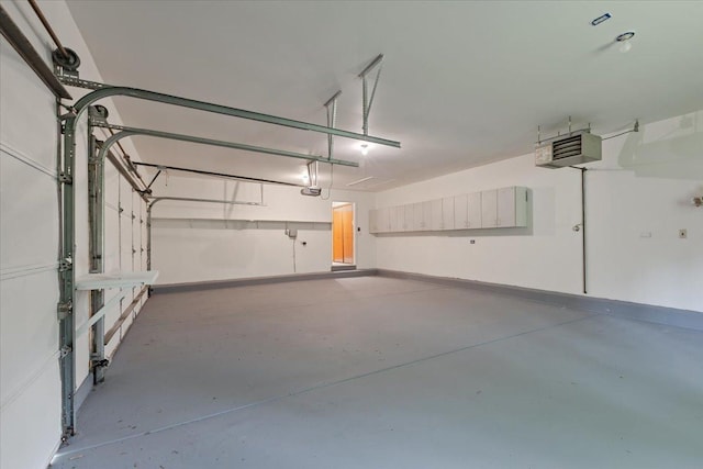 2261 E Gaisor Dr, Crete, IL 60417 - garage featuring baseboards, a garage door opener, and a heating unit