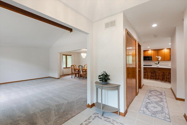 2261 E Gaisor Dr, Crete, IL 60417 - hallway with baseboards, light tile patterned flooring, recessed lighting, light colored carpet, and a chandelier