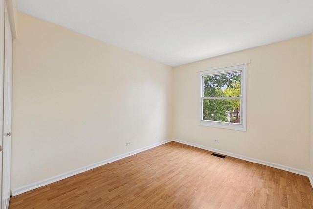 122 E Sherman St, Bartlett, IL 60103 - spare room featuring baseboards and light wood-style flooring