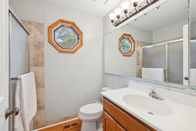 122 E Sherman St, Bartlett, IL 60103 - bathroom featuring a tile shower, vanity, and toilet