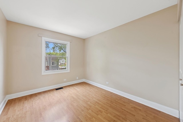 122 E Sherman St, Bartlett, IL 60103 - unfurnished room with light wood-style flooring and baseboards