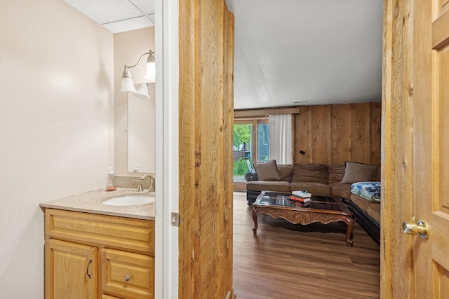 122 E Sherman St, Bartlett, IL 60103 - bathroom featuring vanity, wood finished floors, and wooden walls