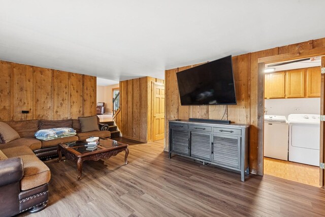 122 E Sherman St, Bartlett, IL 60103 - living area featuring washer and dryer, wood walls, and wood finished floors