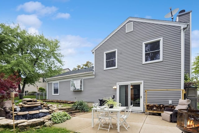 122 E Sherman St, Bartlett, IL 60103 - rear view of property featuring a patio area and an outdoor fire pit