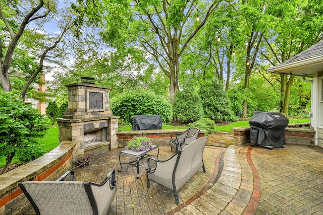 970 Brigham Way, Geneva, IL 60134 - view of patio featuring an outdoor stone fireplace, area for grilling, and view of scattered trees