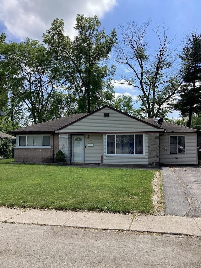 237 Marquette St, Park Forest, IL 60466 - view of front facade with a front lawn and brick siding