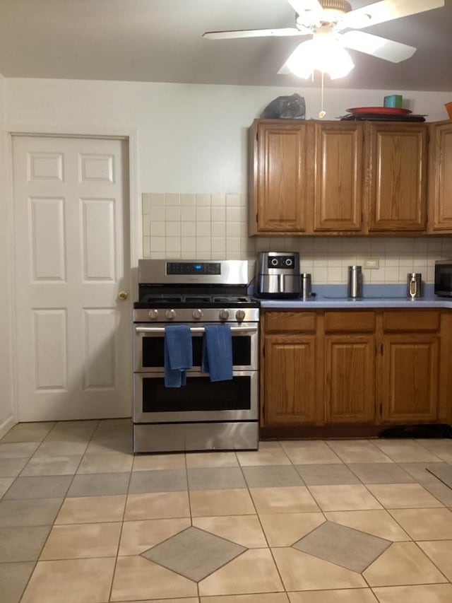 237 Marquette St, Park Forest, IL 60466 - kitchen with range with two ovens, decorative backsplash, and brown cabinets
