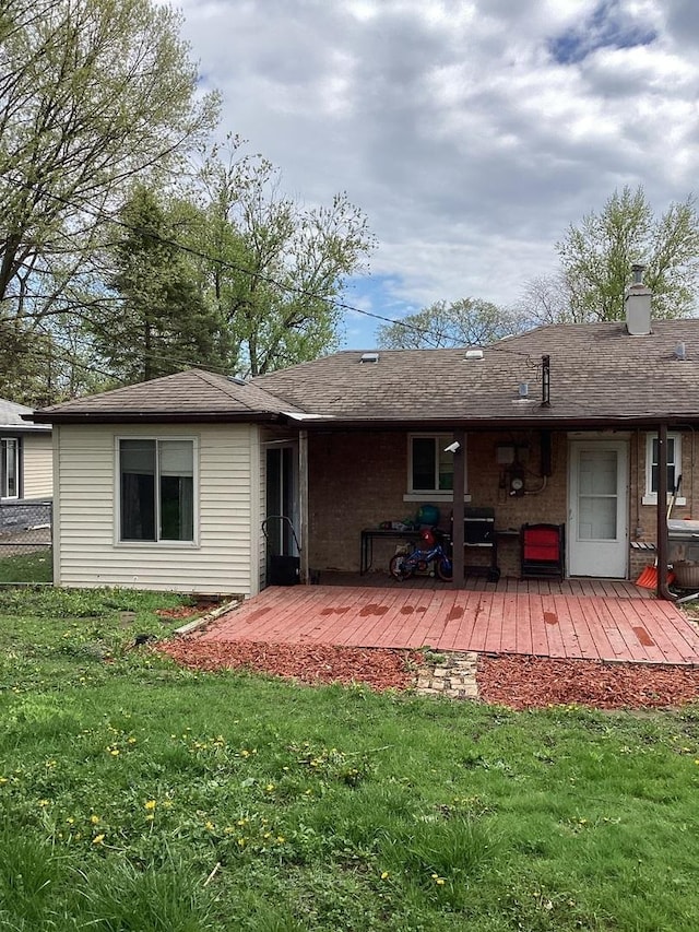 237 Marquette St, Park Forest, IL 60466 - back of property with a lawn, a deck, and a chimney