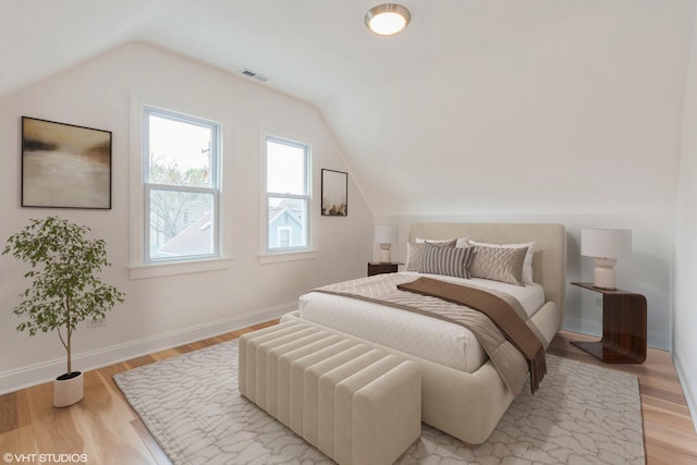 3311 W Belle Plaine Ave, Chicago, IL 60618 - bedroom with vaulted ceiling, light wood finished floors, and baseboards