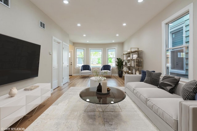 3311 W Belle Plaine Ave, Chicago, IL 60618 - living room featuring recessed lighting, wood finished floors, and baseboards