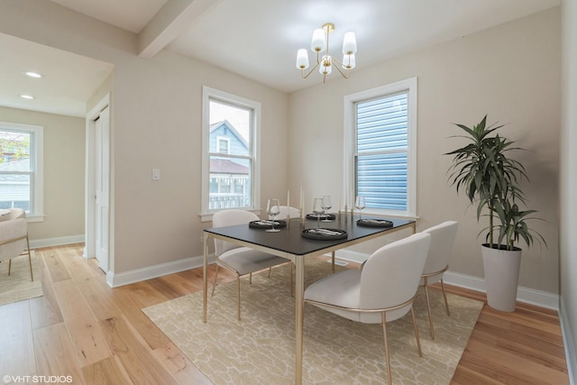 3311 W Belle Plaine Ave, Chicago, IL 60618 - dining space with light wood-style flooring, a chandelier, baseboards, recessed lighting, and beamed ceiling